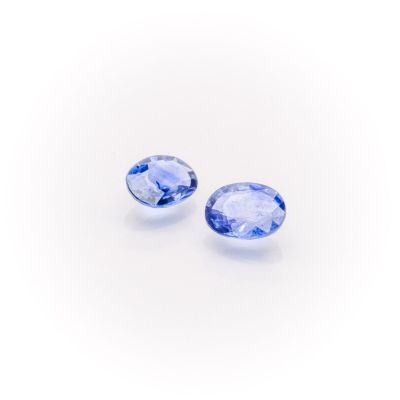 a pair of tanzanite gems on a white background