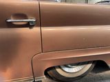 a close up of a car door handle on the side of the car