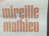 a sign that says mireille mahieu on it