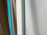 a picture of a white refrigerator with a blue trim