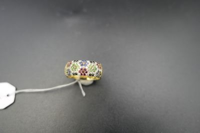 a close up of a ring on a string with a tag