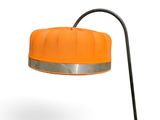 an orange table lamp with a black metal base and a white background