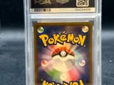 a close up of a pokemon trading card in a plastic holder