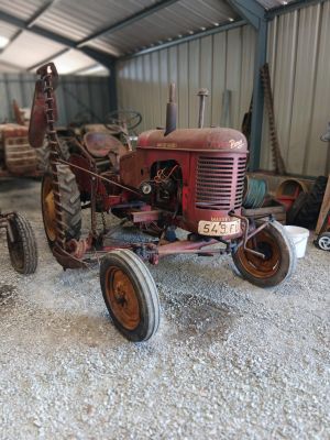 a small tractor that is sitting in a building