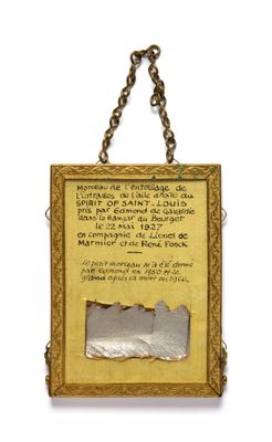 an old picture frame with a chain hanging from it ' s side