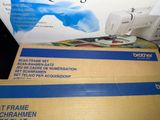 a box with a sewing machine sitting on top of it