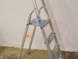 a ladder that is leaning against a wall in a room