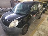 a small black car that is parked in a garage