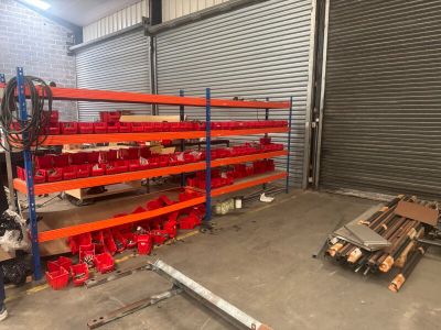 warehouse shelvings with red bins and shelves in a warehouse