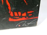 painting of a black and red cat sitting on top of a black box