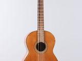 an image of a wooden guitar with a sticker on the back of it
