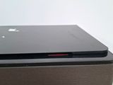 a close up of a laptop computer sitting on top of a wooden box