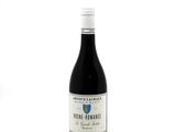 a bottle of wine that is sitting on a table