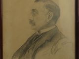 portrait d'un homme en costume-cravate, dans un cadre en bois