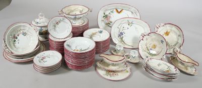 a lot of plates and bowls sitting on a table
