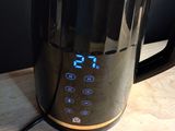 an image of a coffee pot with a digital clock on it