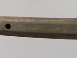 a close up of a metal object with a hole in it