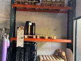 a shelf with a lot of items on it in a warehouse