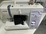 a sewing machine that is sitting on top of a table