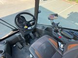 a view of the driver ' s seat of a bus from the driver ' s seat