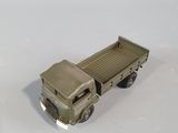 a toy truck that is sitting on a white surface