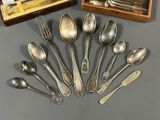 a lot of spoons and spoon spoons in a box