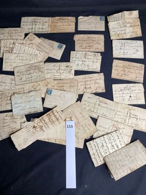 several pieces of old paper with writing on them on a table
