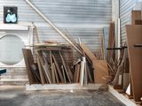 a pile of cardboard and other items in a storage area
