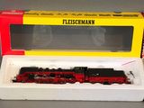 an image of a red and yellow box with a train on it