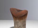 an image of a brown vase sitting on top of a white table
