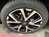 the tire of a car with a flat tire on the ground