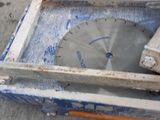 someone is using a circular saw to cut a piece of wood