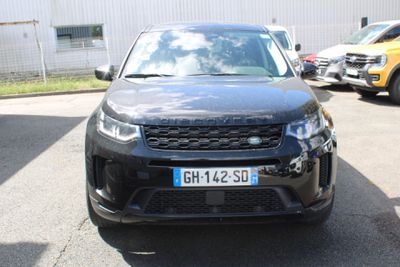 a black car that is parked in a parking lot
