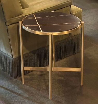 a table that has a marble top on it in a living room