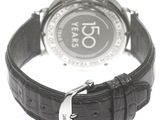 a close up of a wrist watch on a white surface