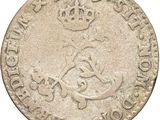 a close up of a coin with a crown on it