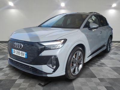 the new audi e - trc suv is parked in a showroom