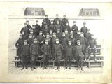 an old photo of a group of men in uniform