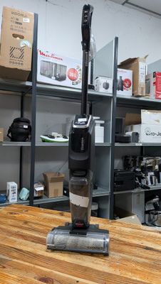 a vacuum that is sitting on a table in a room