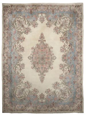 an antique persian rug with a medallion design