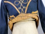 a mannequin with a blue jacket on it