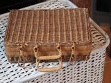 a wicker bag sitting on top of a wicker table