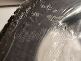 a close up of a plastic bag on top of a stove