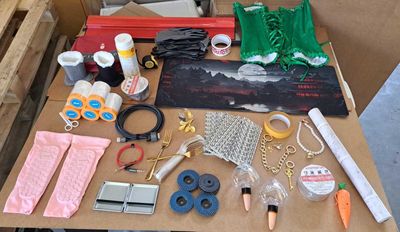 a table with a bunch of crafting supplies on it