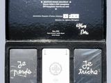 a black box with three playing cards in it