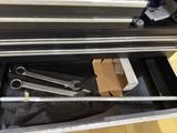 a box with tools inside of it on the floor