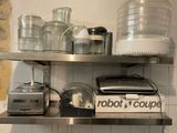a metal shelf with a blender, a blender, and a blender on it