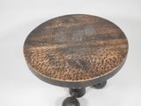 a small table with a wooden top on a white background