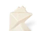 a small white object that looks like an origami
