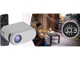 a picture of a projector with a remote control next to it